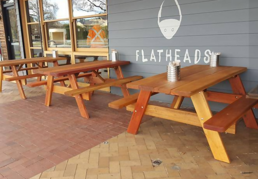 Australian made hardwood picnic table by Billabong Garden Furniture displayed in a modern commercial dining space