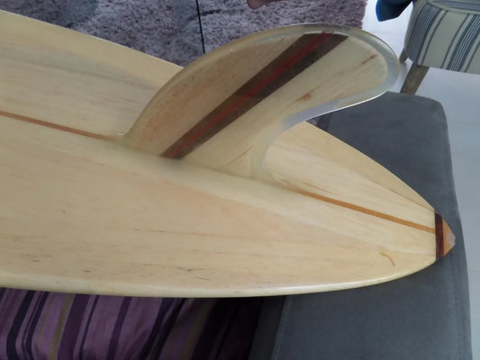 Close-up of the fin and rail on a Riley foam core balsa Hawaiian Gun surfboard