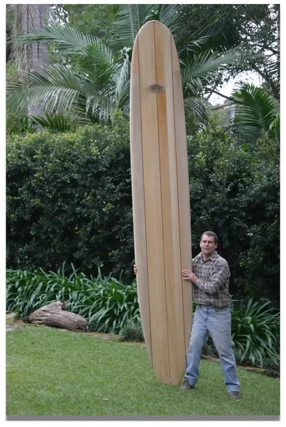 Full length 12ft Riley Solid Balsa Classic Malibu surfboard standing outdoors
