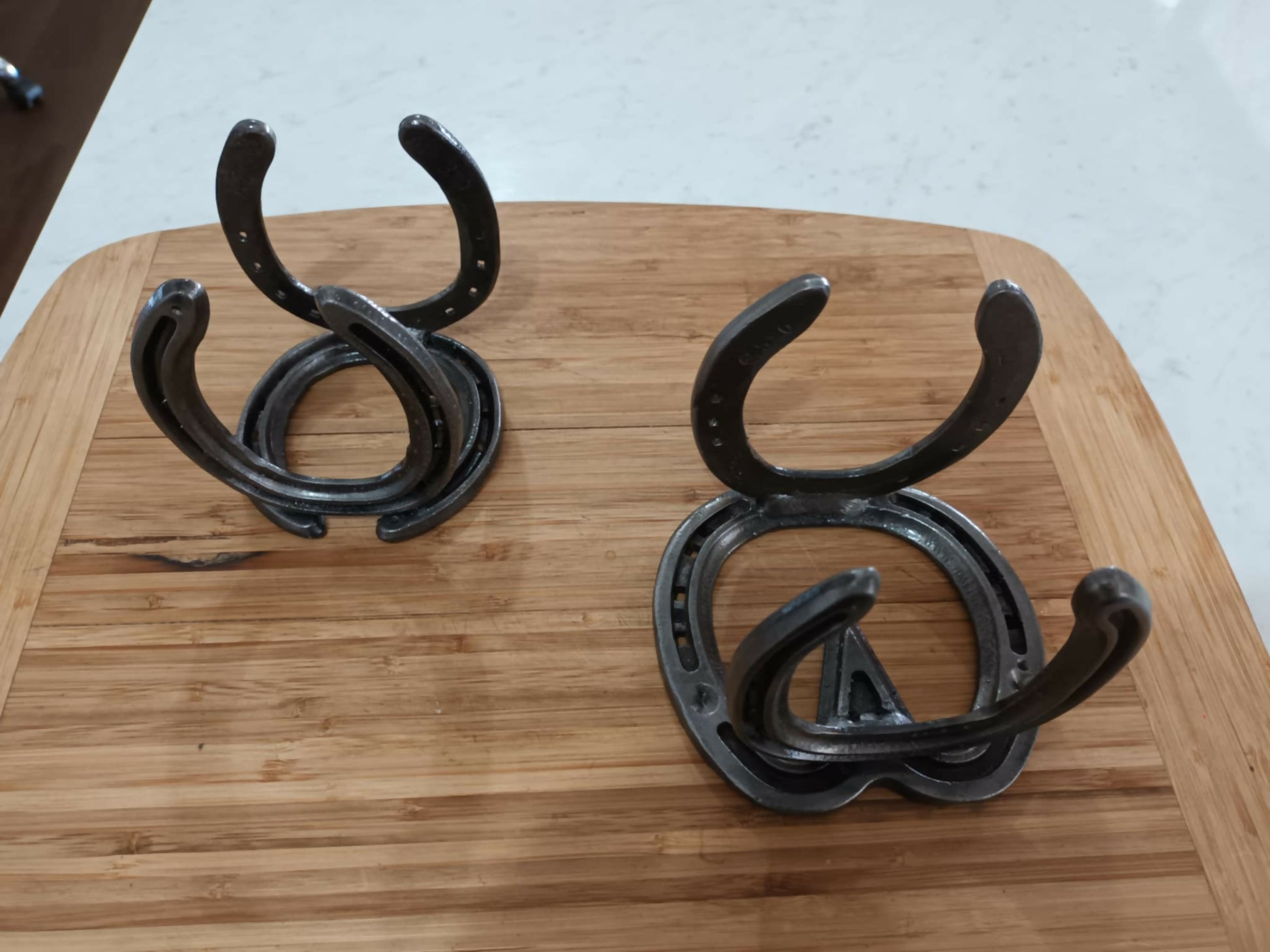 Twin set of handmade horseshoe envelope and book holders by Noah’s Creations.