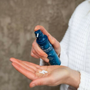 Botany Essentials Native Flora Night Crème being dispensed into hands