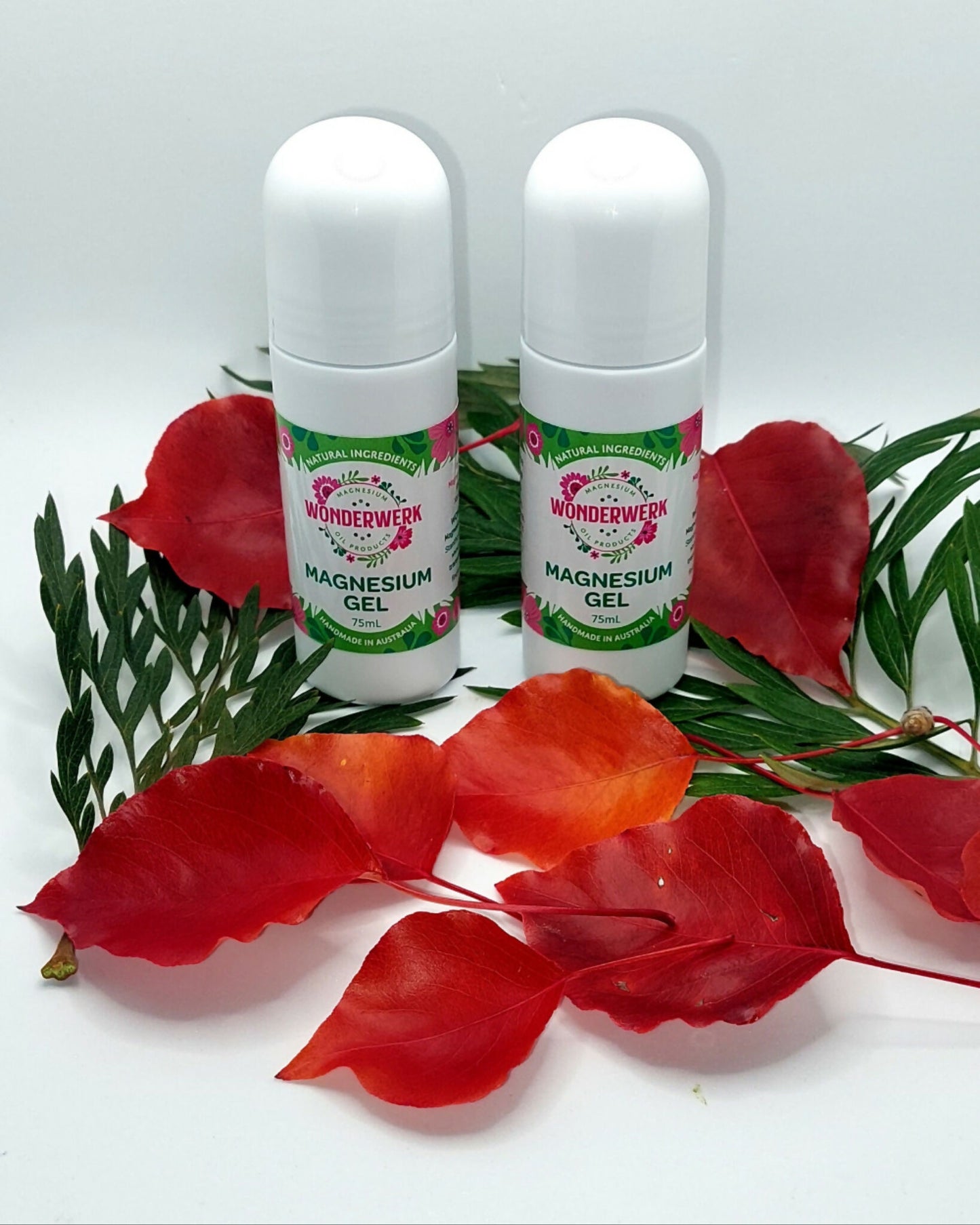 Wonderwerk Magnesium Roll On Gel two pack with red flowers and greenery