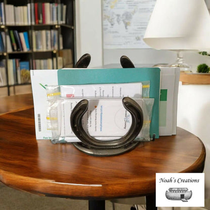 Handmade horseshoe envelope and book holder by Noah's Creations holding letters, documents and folders.
