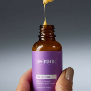 Botany Essentials DNA Serum Age Reverse being applied by model