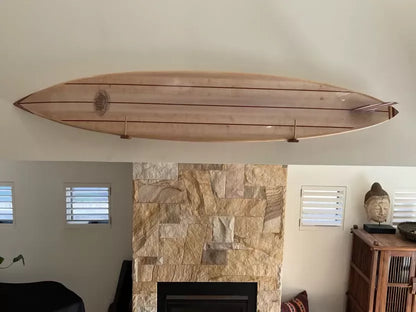 Side profile of the solid balsa Hawaiian Gun surfboard displayed indoors