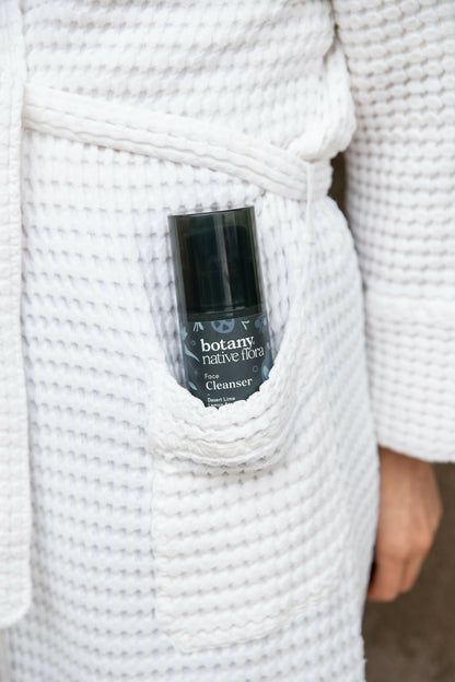 Native Flora Australian face cleanser product in robe pocket lifestyle image
