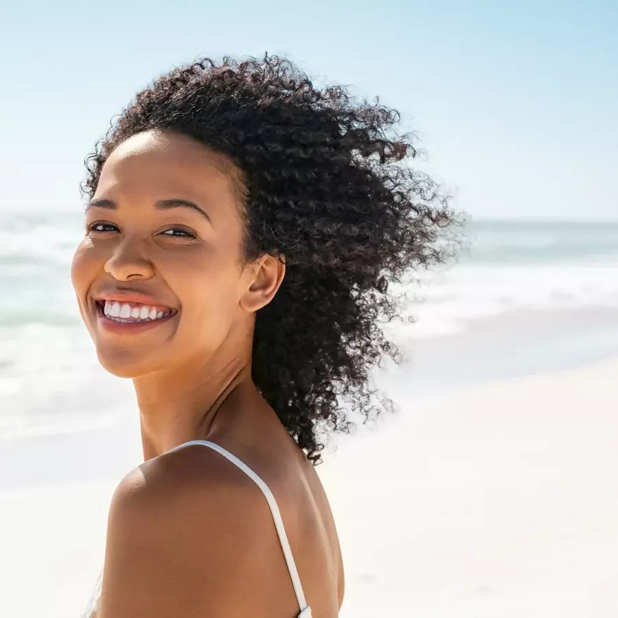Woman with clear skin outdoors representing natural skincare routine