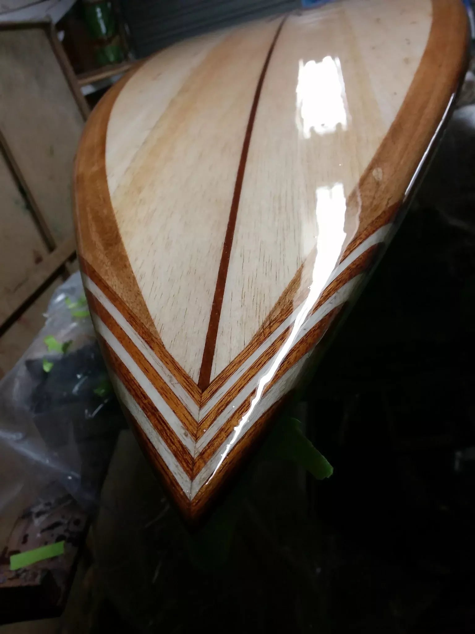 Close-up of the handcrafted timber tail on a Riley foam core balsa Hawaiian Gun surfboard