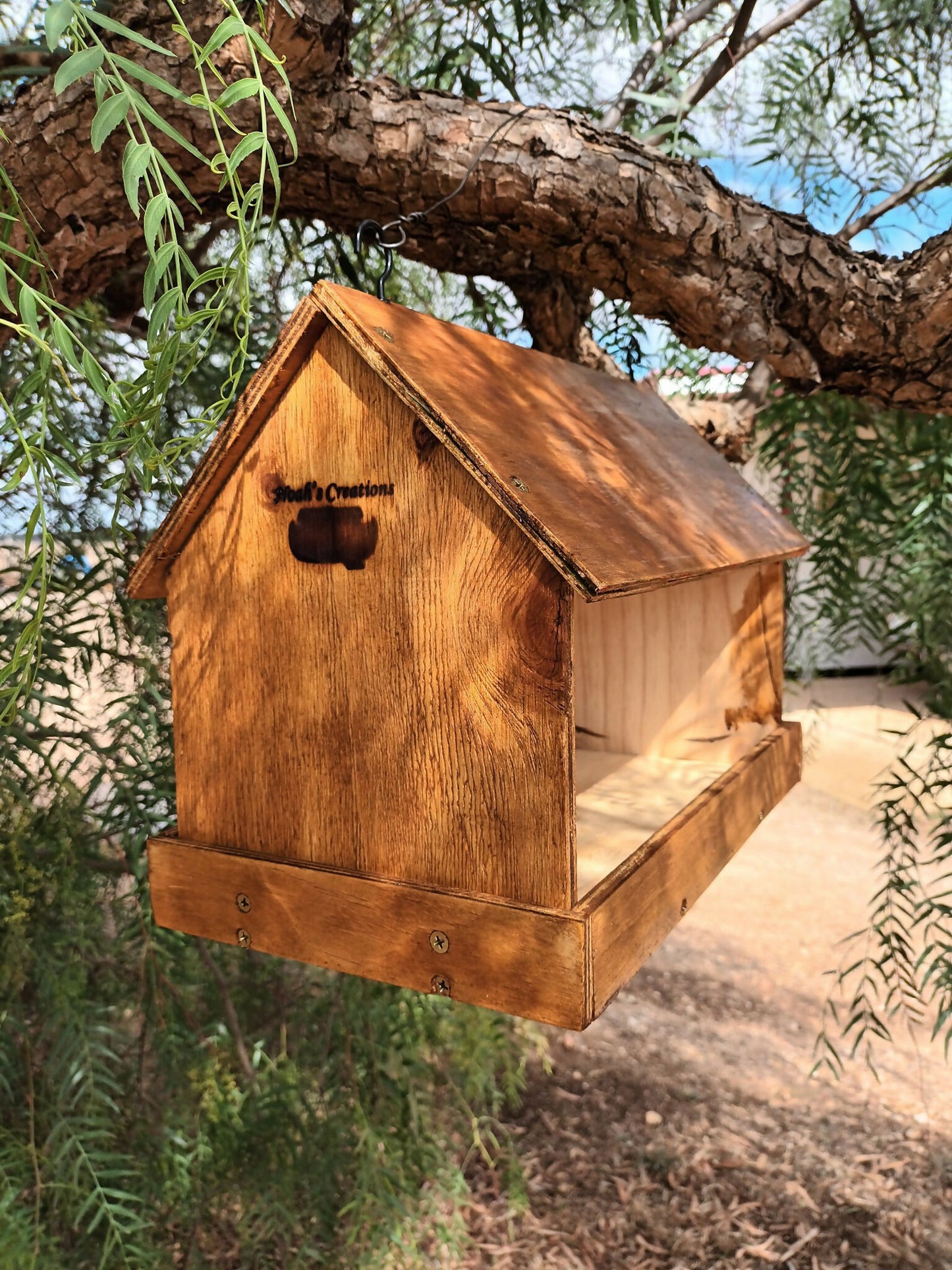 Handmade native bird feeder by Noah’s Creations hanging in a tree