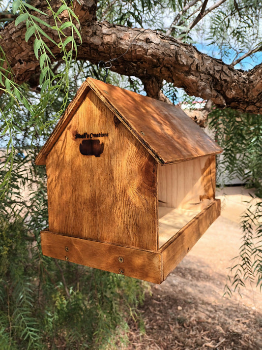 Handmade native bird feeder by Noah’s Creations hanging in a tree