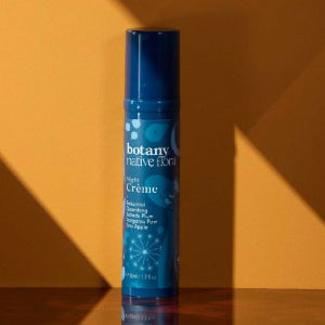 Botany Essentials Native Flora Night Crème bottle in warm lifestyle setting