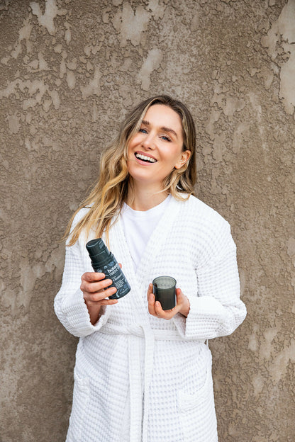 Woman using Australian Native Flora face cleanser for refreshed healthy skin