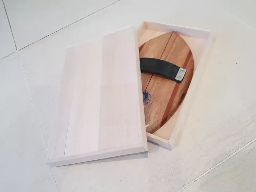 Riley solid balsa bodysurfing handboard presented with its balsa storage box