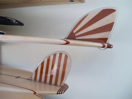 Close-up of striped timber fins for the Riley Allrounder solid balsa Mini Malibu