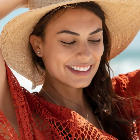 Woman outdoors representing gentle pregnancy and postpartum skincare