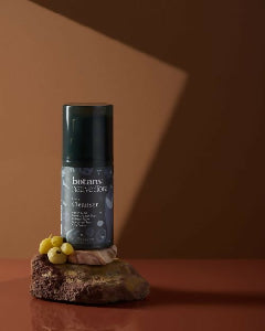 Botany Essentials Native Flora Face Cleanser bottle in warm lifestyle setting