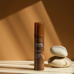 Botany Essentials Native Flora Day Crème bottle in warm lifestyle setting