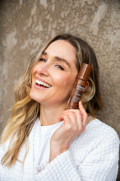Woman using Australian Native Flora Day Crème anti ageing skincare moisturiser
