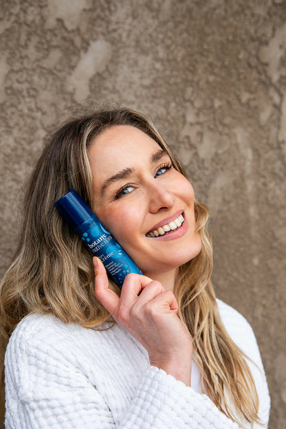 Woman using Australian Native Flora Night Crème skincare moisturiser for glowing skin